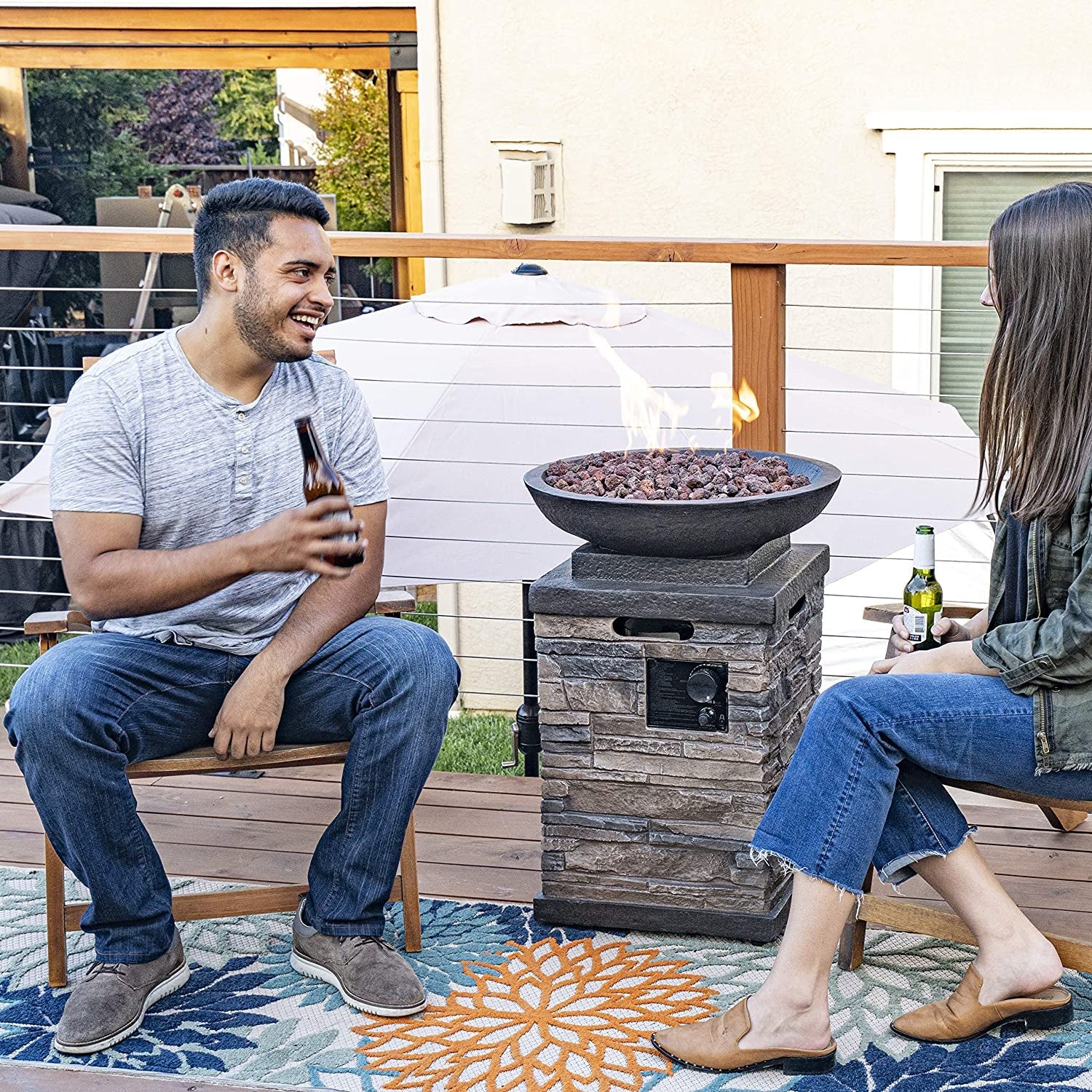 "Enhance Your Outdoor Ambiance with the Newcastle Propane Firebowl Column - Realistic Look Firepit Heater with Lava Rock, 40,000 BTU Outdoor Gas Fire Pit - Experience the Beauty of Natural Stone!"