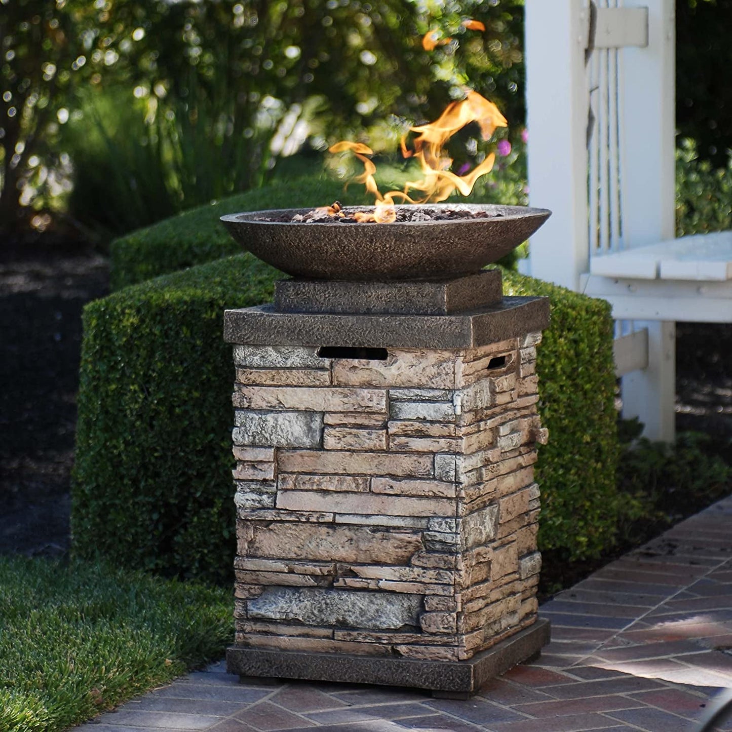 "Enhance Your Outdoor Ambiance with the Newcastle Propane Firebowl Column - Realistic Look Firepit Heater with Lava Rock, 40,000 BTU Outdoor Gas Fire Pit - Experience the Beauty of Natural Stone!"